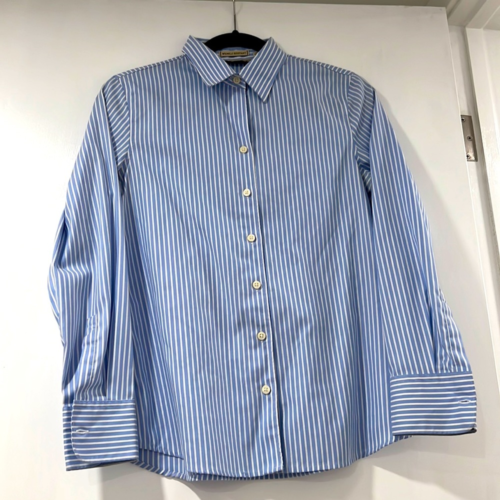 Business shirt or equally for casual weekend with sleeves rolled up and cutoffs